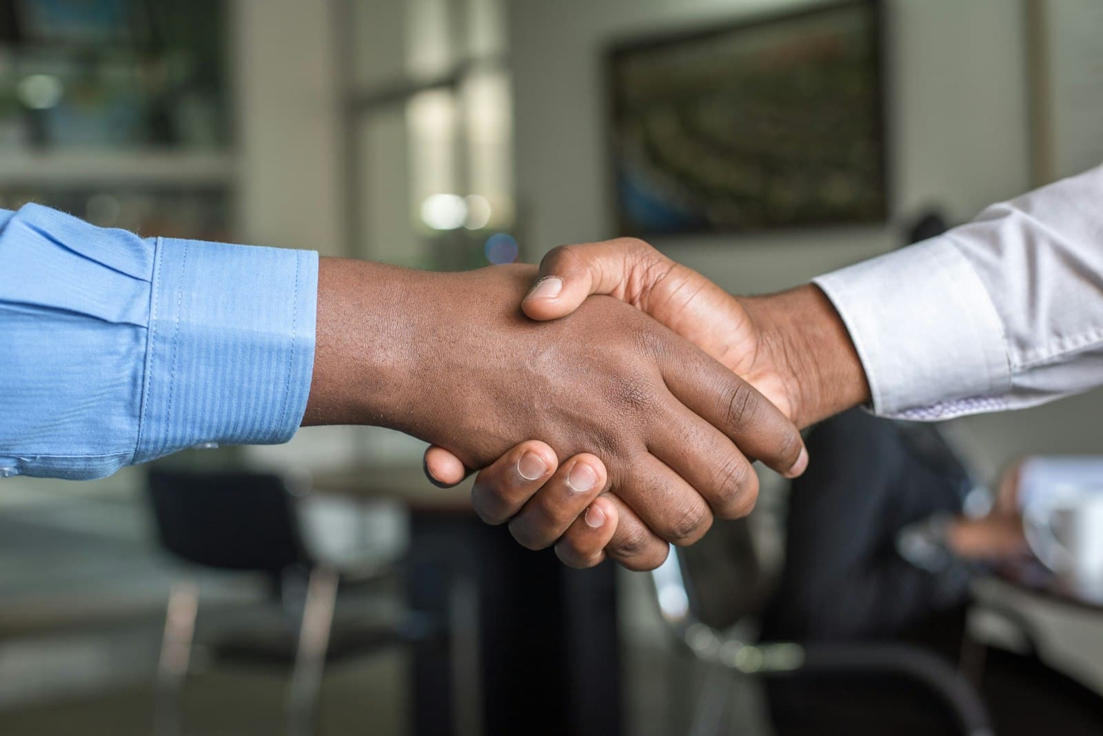 Business partners shaking hands over a successful agreement